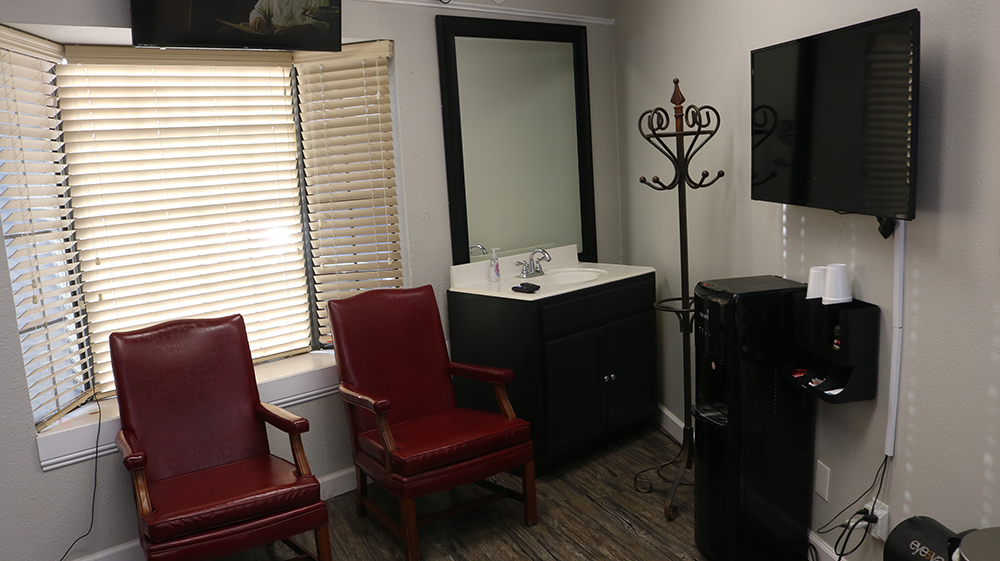 Waiting area and sink area at Bladez Barber and Braiding